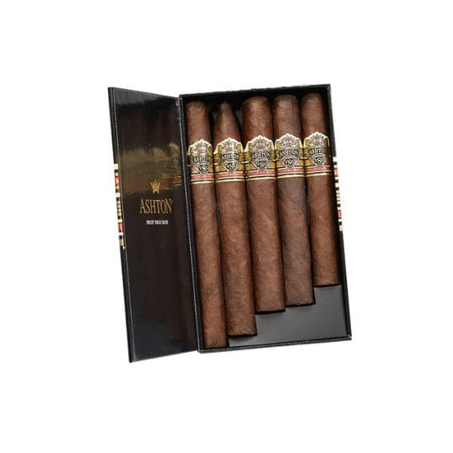 An open black Ashton VSG Sampler Box reveals six full-bodied cigars, each with elegant gold, red, and white bands—a premium gift set perfect for cigar aficionados.
