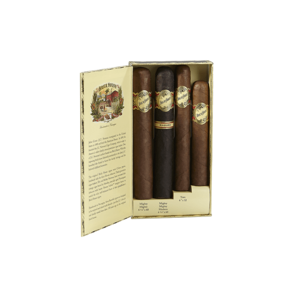 The Brick House Mighty Sampler by Brick House Cigars features five Nicaraguan cigars in assorted shades with branded labels, displayed in an open box with a printed description on the inside cover.