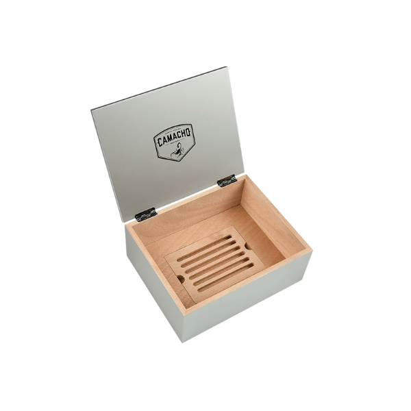 The Camacho 30 Cigar Desktop Humidor is a rectangular wooden humidor with the lid open, featuring the Camacho logo inside and a slatted Spanish cedar tray at the bottom.