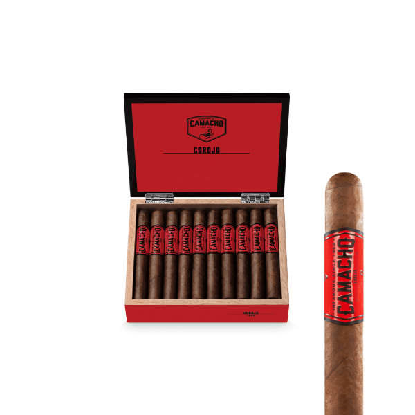 An open red Camacho Corojo Toro box reveals neatly arranged, full-bodied cigars inside. Beside the box, a single Camacho Corojo Toro cigar with a red label is displayed.
