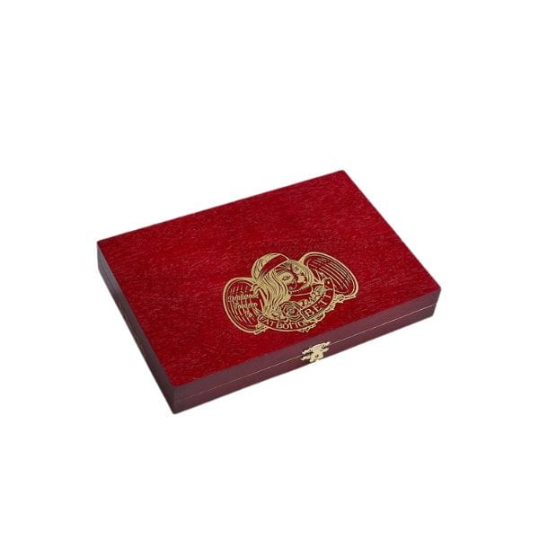 A closed rectangular red wooden box with a gold eagle emblem and clasp, ideal for storing your favorite Deadwood Tobacco Cigars Deadwood Fat Bottom Betty Toro.