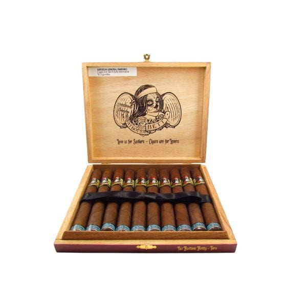 Open wooden cigar box with Deadwood Fat Bottom Betty Toro cigars from Deadwood Tobacco Cigars in two rows, featuring a pirate illustration and text on the inside lid.