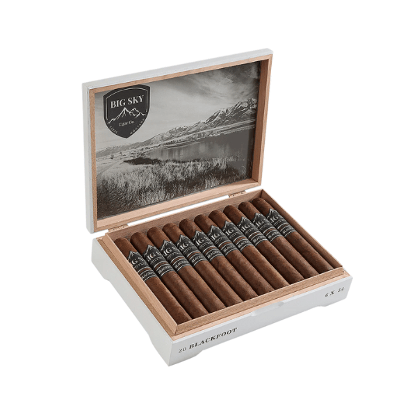 A wooden cigar box labeled "Big Sky Cigars Blackfoot Toro" presents 20 cigars with black bands, each wrapped in a luxurious San Andrés leaf, all set before a black-and-white landscape image inside the lid—an ideal choice for outdoor cigar lovers.