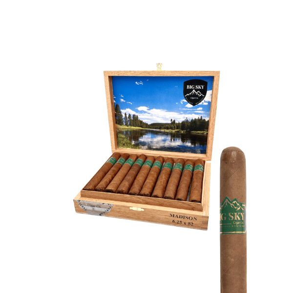 Open wooden cigar box labeled “Big Sky Cigar Madison Toro” from the Montana River Series, containing cigars; one Habano wrapper Big Sky Cigar Madison Toro is displayed separately in the foreground, and a scenic lake image decorates the inside of the box lid.