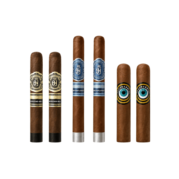Six cigars from the Crowned Heads Cigar Sampler are displayed upright in a row, each featuring unique colored bands and labels with different designs, logos, and text—including boutique selections like Jericho Hill—set against a plain white background.