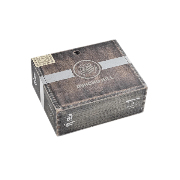 A closed wooden cigar box labeled “Jericho Hill,” distinguished by a gray stripe and seal on top, sits elegantly against a white background. This box contains the acclaimed Crowned Heads Jericho Hill OBS blend, featuring a rich Mexican San Andrés wrapper.