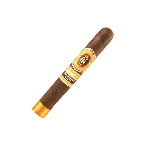 A single Crowned Heads Tennessee Waltz Toro cigar, featuring a brown Connecticut Broadleaf wrapper and adorned with a gold and brown label plus a gold band on one end, crafted by My Father Cigars and displayed on a white background.