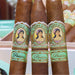 Three La Aroma De Cuba Pasion Robusto cigars stand in a box, each with vintage-style bands showing a woman's portrait—a classic Nicaraguan puro from La Aroma De Cuba.