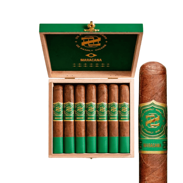 A wooden box of six Oz Family Cigars Maracana Robusto—medium to full-bodied cigars with green and gold labels—displays a rich Brazilian Arapiraca wrapper, with one cigar standing upright beside the open box.