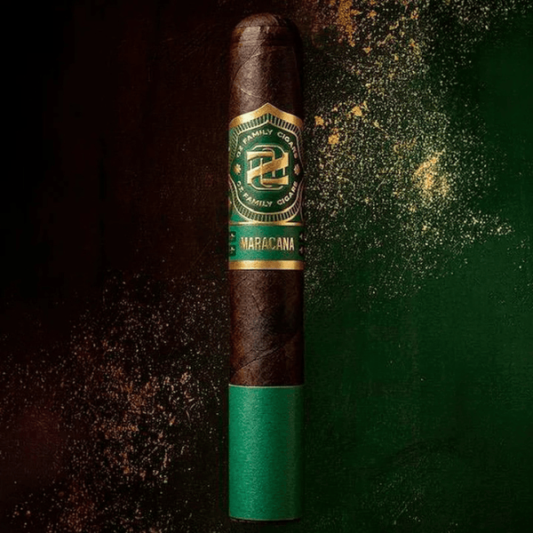 A dark brown Oz Family Cigars Maracana Robusto, adorned with a green and gold band and set against a striking split black and green background. Expertly crafted with a Brazilian Arapiraca wrapper, this medium to full-bodied cigar exemplifies the rich tradition of Oz Family Cigars.
