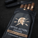 A black pouch labeled “After Action Cigars Spartan Collaboration” contains five limited-edition Spartan Blades Habano Toro cigars, with a Spartan Blades knife and another object in the background on a dark surface.